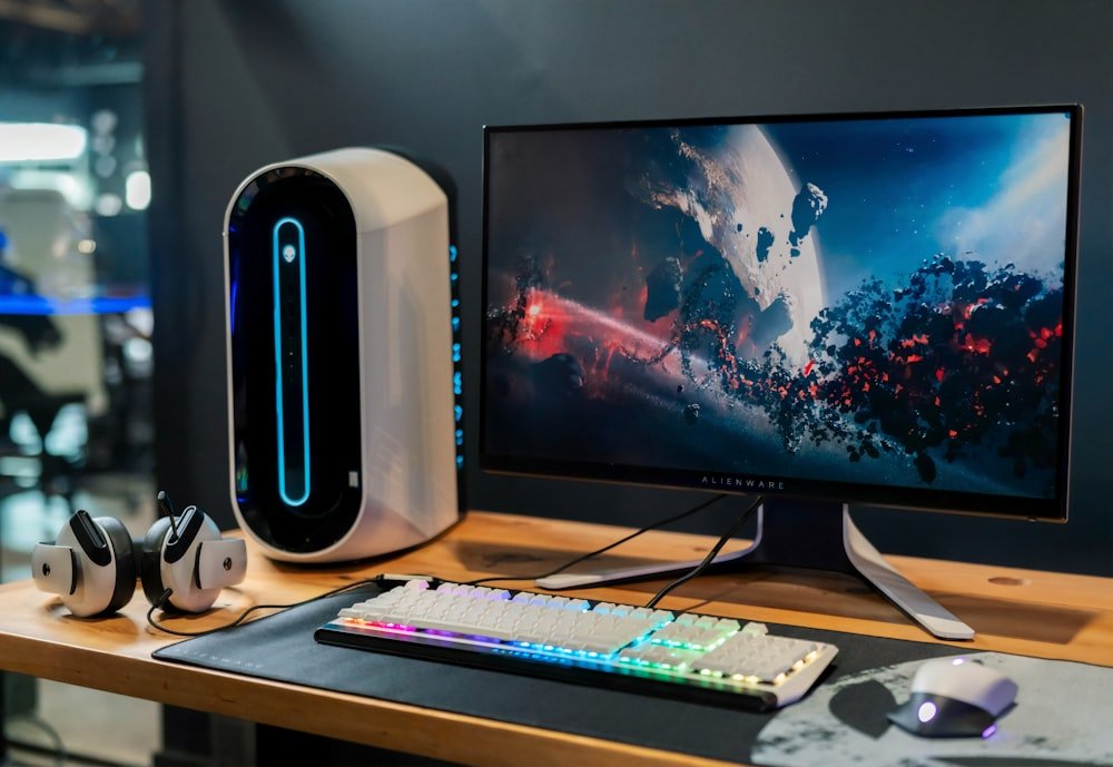 Desktop tower with a wide monitor and keyboard